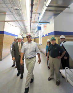 Dan Pallotta, president of P3 Incorporated, leads, left-right, Robert Todisco, assistant project manager, Westfield Mayor Daniel Knapik, Tammy Tafft, Westfield purchasing director, Jim Laverty, Westfield Vocational-Technical High School director, and Jeff Daley, city advancement officer, during a tour of the Westfield Vocational-Technical High School in 2012. (File photo by chief photographer Frederick Gore)
