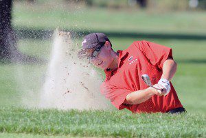 Westfield's Jeremy Doody chips from sand trap during a regular season match. Doody helped the Bombers get out of a "trap," delivering during the season's final stretch. (Photo by chief photographer Frederick Gore)