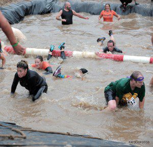 Participants plough through cold, icy water at the Rugged Maniac event in 2012. (Staff Photo)
