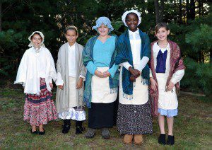 Munger Hill Elementary School fifth-grade students, left-right, Altha Fiordalice, Shannon Sullivan, Erin Olearcek, Jessica Crosby and Emily Gelinas dress in period costume for the Colonial Harvest Days in Westfield in 2012. The students acted as tour guides at the Old Burying Ground located at Mechanic Street in Westfield, which is one of the oldest cemeteries in the United States. The cemetery was established on April 27, 1668. (File photo by Frederick Gore)
