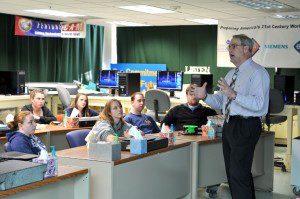 Westfield Vocational-Technical High School Manufacturing Technology Instructor Clement Fucci, speaks to a group of students in the schools state-of-the-art computer aided manufacturing design lab. (File photo by chief photographer Frederick Gore) 