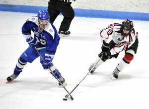 Westfield senior forward Adam Collier, right, took two steps inside the blue line and zipped a shot into the net 1:25 into OT to lift the Bombers to a 2-1 win over fifth-seeded West Springfield in the Western Massachusetts Division III semifinals at the Olympia. (File photo by chief photographer Frederick Gore)
