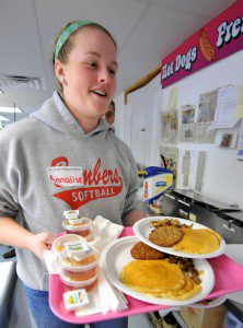 Annalise Eak, of Southwick, volunteers her time to serve the hundreds of visitors that attended the Southwick Police Association Pancake Breakfast fundraiser at Moo-Licious in Southwick Saturday.  (Photo by chief photographer Frederick Gore)