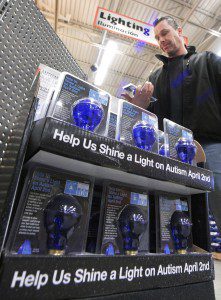Neil Roache, of Westfield, checks out the "Light it up Blue" light display at the Home Depot store on East Main Street in Westfield Thursday. Home Depot has partnered for the third year to shine a light on autism during Autism Awareness Month in April and World Awareness Day on Tuesday. The special blue light bulb can be purchased for $1.99 with $1.00 from each sale benefiting the Autism Speaks program. Home Depot will donate up to $150,000 as part of the special promotion. For more information on the program log into www.lightupblue.org (Photo by chief photographer Frederick Gore)