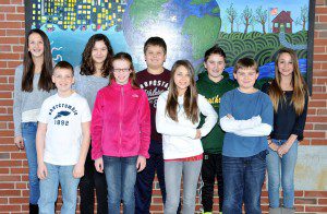 Powder Mill Middle School sixth-grade students, left-right,Molly McGrath, Cameron DiSanto, Liz Methe, Emily Giancola, Andrew Lachtara, Victoria Podmore, Matt Keenan, John Westcott and Allison Hauff, all members of the "Youth Assisting Seniors" volunteer program, gather in front of a school mural after competing in a state-wide school Community Problem Solving contest. (Photo by chief photographer Frederick Gore)