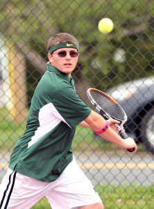 St. Mary's No. 1 Zack Brown eyes the ball during yesterday's match with Central at the Municipal Courts in Westfield. (Photo by Frederick Gore)