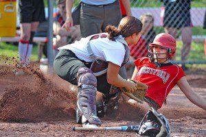 Westfield's Katelyn Puza, right, beats the tag of Ludlow catcher Ashley Hitchcock during Friday's game in Westfield. (Photo by Frederick Gore)