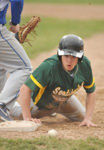 Southwick's Nick Massarelli stares at the ball after a Monson first baseman attempted the tag. Monson failed to realize the ball was missing from his glove at the time of the tag. (Photo by Frederick Gore)
