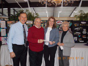 Alfred Pinciak, president of the Retired Educators Association of Massachusetts – Hampden West Chapter, Stan Kozilowski, treasurer, and Janice Phillips, membership chair,  present a $500 check to Andrea Allard of the Y for the PWY Scholarship Fund.  (Photo submitted)