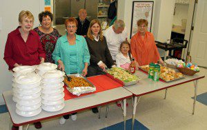 A team of volunteers from Our Lady of the Blessed Sacrament Church prepared and served Easter dinner on Sunday at the Westfield Soup Kitchen. Over 75 people enjoyed this holiday meal.  (Photo by Don Wielgus)  