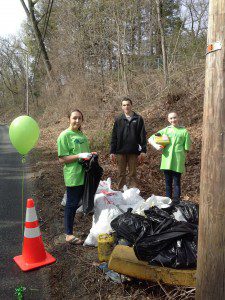 Lauren Roache, Stephen Roache and Olivia Clark help clean Lloyds Hill.  (Photo submitted)