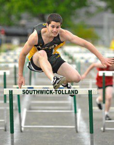 Southwick's Colin Devin competes in the 110-hurdles during Monday's match against Hampshire Regional. (Photo by Frederick Gore)