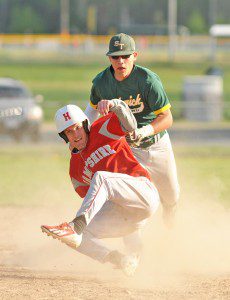 Southwick's Vinny Fortini, rear, attempts to chase down a Hampshire Regional runner during a 2013 regular season game. (Photo by Frederick Gore)