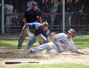Gateway catcher Justin Edinger attempts to apply the tag to Easthampton's Chris Starcun in a 2013 Western Massachusetts Division 3 tournament game. (Photo by Chris Putz)