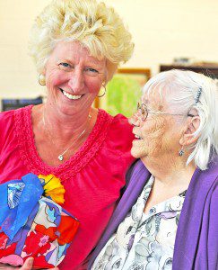 Southwick Council on Aging Director Jeanne Margarites, left, hugs longtime mentor Doris Sleeper who retired in 2000 when Margarites came on board as the new director. A retirement luncheon was staged in honor of Margarites at the Southwick Town Hall, Wednesday. (Photo by Frederick Gore)