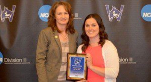 Kayley Miller, right, receives the Westfield State University Senior Female Athlete of the Year award from Nancy Bals, Westfield State associate athletics director/senior women's administrator. (Photo by Mickey Curtis)
