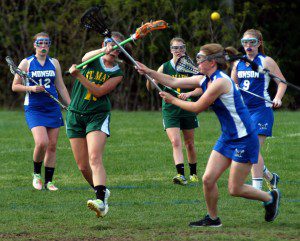 The St. Mary High School girls' lacrosse team actively pursues another goal in the second half against host Monson Friday. (Photo by Chris Putz)