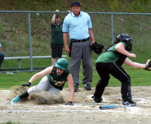 Southwick's Lindsey Wilcox slides in safely on Jenn Yelin's first-inning single, the second of 10 runs from the Rams in the inning. (Photo by Chris Putz)