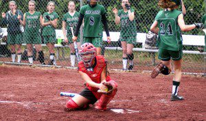 Westfield catcher Katelyn Puza catches the ball at home plate as a Minnechaug baserunner scores. (Photo by Chris Putz)