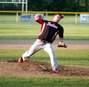 Westfield pitcher Matt Irzyk winds up for a pitch early in the team's playoff game against Chicopee Comp Thursday night at Bullens Field. (Photo by Chris Putz)