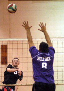 Westfield's C.J. McMahon (5) attempts to hit the ball past Holyoke's Phillips Estrada-Ortiz (8) and the Purple Knights in the Western Massachusetts Division 1 boys' volleyball tournament quarterfinals. (Photo by Chris Putz)
