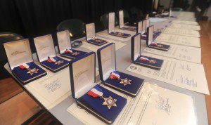 Medals and citations cover a table at Westfield Middle School South before the begining of a police awards ceremony Thursday evening. (Photo by Carl E. Hartdegen)