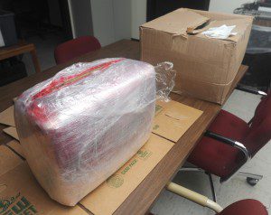 An 18-pound plastic wrapped bundle of marijuana was found in a box which was delivered to a city video game store after the shipper apparently listed the store's address as the return address and it was returned to sender when it could not be delivered in Philadelphia, Penn. (Photo by Carl E. Hartdegen)