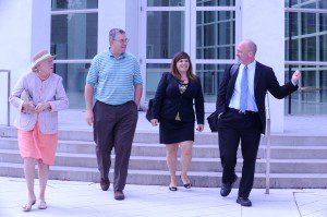 Jane Wensley and David Flaherty as they exit the U.S. District Court in Springfield with paralegal Michelle Llosa and attorney Luke Ryan yesterday after a hearing in their case against Mayor Daniel Knapik. (Photo by Carl E. Hartdegen)