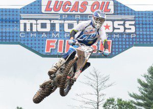 A driver flies under the finish line during a practice prior to Saturday's Lucas Oil Pro Motocross Championship in Southwick. (Photo by Frederick Gore)