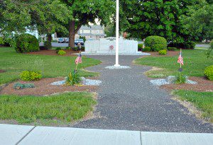 The War Memorial located near the Southwick Congregational Church at the intersection of Depot Street and College Highway could be relocated due to non-compliance with the American Disabilities Act. A stone walkway presently leads visitors to the stone. (Photo by Frederick Gore)