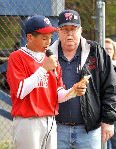 John Wheeler, right, is joined at home plate by Westfield Little Leaguer Tyler Delgado during opening day of Westfield Little League last year. Wheeler recently sat down to discuss some topics regarding Little League  with the All-Star postseason only days away. (File photo by Frederick Gore)