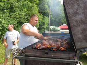 James Grannells of team TAC mans a smoking hot grill during Southwick Rotary's Grill'n Daze 2013. (File photo by Hope E. Tremblay)