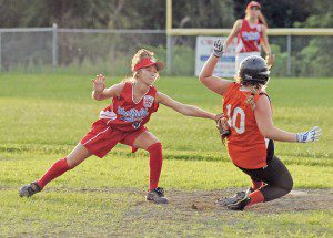 Westfield Senior League All-Star shortstop Kelsey Kiltonic, left, makes the out on a Quaboag runner during last night's game at Lewis Field in Brookfield. (Photo by Frederick Gore)