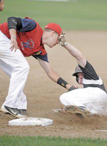 Westfield American Legion Post 124 third baseman Connor Sas, left, makes the tag on South Hadley Post 260 runner Connor Sheridan during last night's game under the lights of Bullens Field. (Photo by Frederick Gore)