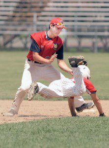 Westfield American Legion Post 124 second baseman Timothy Donahue, left, makes the tag on Aldenville's Travis Seymour whom was caught between second and third base. (Photo by Frederick Gore)