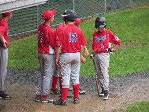 Westfield North's (#5) conversates with teammates during a rain delay  at Paper Mill  Field Wednesday (Photo By Peter Francis)