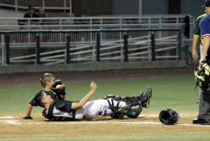 Westfield catcher Nate Boucher blocks the plate and holds on to the ball despite the collision for an out to end the first inning against Vermont in a New England Regionals tournament game Monday in Manchester, New Hampshire. (Submitted photo)