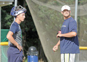 Seattle Mariners former pitcher Tim Boyce, right, chats with Evan Moorhouse during a practice at Westfield State University. (Photo by Frederick Gore)