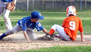 Westfield South Little League 11-Year-Old All-Stars shortstop Matt Pelletier applies the tag on Agawam's Dawson Mansfield (9) as catcher Tanner Koziol gunned down the would-be base stealer at second. (Photo by Chris Putz)