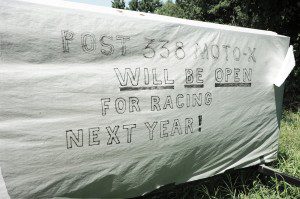 A homemade sign at the entrance of Southwick American Legion Post 338 indicates that racing will continue during the 2014 season. (Photo by Frederick Gore)