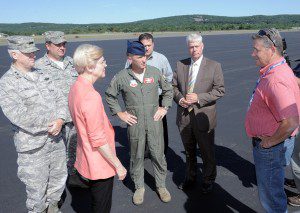 Westfield Barnes Regional Airport Manager Brian Barnes, right, chats with Sen. Elizabeth A. Warren, D-Mass, during a stop in Westfield yesterday. Warren toured the current runway construction project with, left-right, Maj Gen. L. Scott Rice, Adjutant General of the Massachusetts National Guard, Brig Gen. Gary Keefe, Adjutant General (Air) Massachusetts National Guard, Col. James Keefe, 104th Fighter Wing commander, Westfield City Advancement Officer Jeff Daley, and Richard K.Sullivan Jr., Executive Office of Energy and Environmental Affairs.