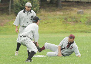 A Westfield Wheelman, right, slides safely under the tag of a Pittsfield Elms second baseman during Saturday's vintage base ball game at Berkshire Industries. (Photo by Frederick Gore)