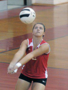 Westfield's Maddy Atkocaitis, bumps the ball during the third set of last night's match with Sci-Tech. (Photo by Frederick Gore)