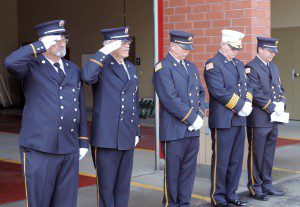Members of the Southwick Fire Department stand during a moment of silence for the victims of 9/11. (Photo by Frederick Gore)
