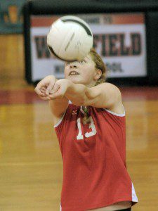 Westfield's Kelsey Johnstone bumps the ball during a high school girls' volleyball match against visiting Ludlow late Monday night. (Photo by Frederick Gore)