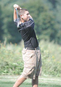 Westfield's No. 1 golfer Cam DiRico watches the flight of the ball during Wednesday's match against Northampton. (Photo by Frederick Gore)