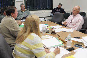 James M. Mazik, seated right, deputy director for operations of the Pioneer Valley Planning Commission, explains a grant program to Southwick officials during last night's Board of Selectmen meeting in Town Hall. (Photo by Frederick Gore)