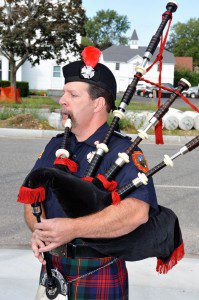 Westfield firefighter Roger Bernier plays a bagpipe during a 911 remembrance ceremony at the Broad Street headquarters. (File photo by Frederick Gore)  