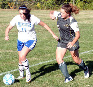 Southwick's Morgan Wundt, right, attempts to outmuscle Monson's Brianna Murphy Monday. (Photo by Chris Putz)