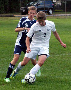 Westfield's Eric Shilyuk (7) dribbles the ball ahead of a Northampton defender. (Photo by Chris Putz)